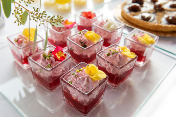 Dessert buffet in single portions of strawberry mousse