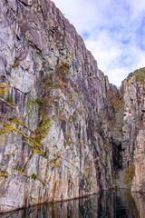 Gap in a mountain wall in the Lysefjord not far from the tourist attraction Preikestolen, Rogaland, Norway