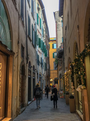 people walking on an Italian  street city during Christmas  time