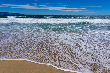 Wave retrieving from the short with beautiful colors and movement