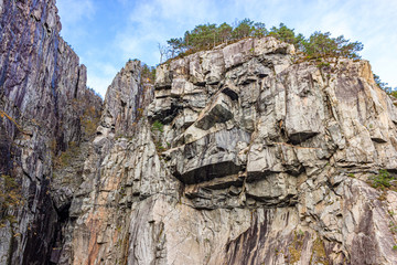 Edgy stone formations of a mountain wall in the Lysefjord, Rogaland, Norway