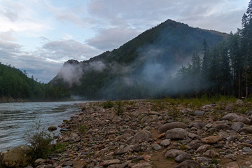 Low clouds in a mountain gorge.
