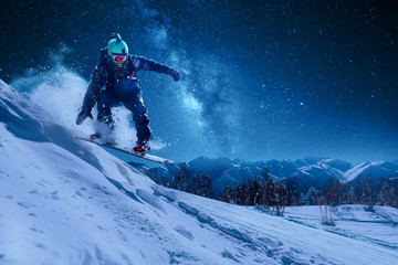 night skating snowboarder is jumping with snowboard under the starry sky and moonlight © Аrtranq