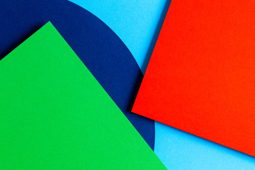 Abstract colored paper texture background. Minimal geometric shapes and lines in red, light blue,...