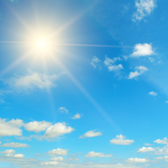 Fototapeta na wymiar Bright midday sun in the blue sky.