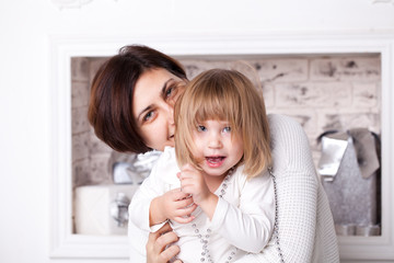 Mom and daughter hug together. Family happiness concept