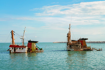 Fototapeta na wymiar Panaroma view of Mersin and Shipwreck, Sunken ship near international sea port of Mersin. Turkey