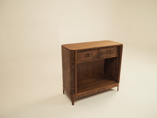 Original designer chest of drawers made of natural wood in its entirety, as well as its details on a white background, from different angles.