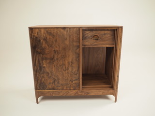 Original designer chest of drawers made of natural wood in its entirety, as well as its details on...