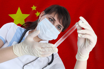 Scientist woman with test tube Coronavirus or COVID-19 against China flag. Research of viruses in...