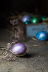 Easter background with painted Easter eggs in vintage style over dark background