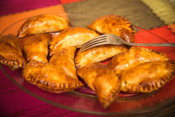 close-up of pile of homemade stuffed empanadillas. typical Spanish food