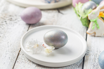 Easter table with Easter eggs over white background