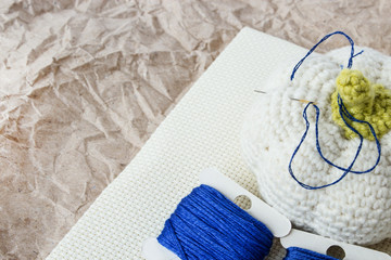 Accessories for needlework. Threads for classic blue embroidery. Female hobby. Copy space.