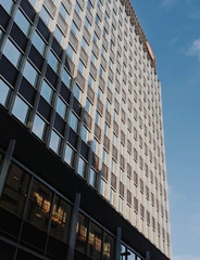 Large office building from low angle with blue sky Liverpool
