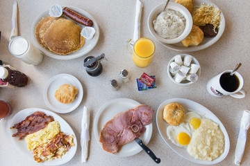 breakfast spread with eggs pancakes and coffee