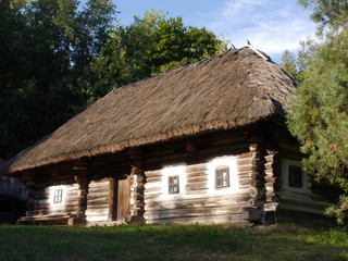 Plakat Old traditional Ukrainian village houses. Typical rural architecture. Summer outdoor landscape. Village Pirogovo.