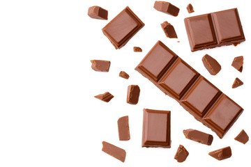 Milk chocolate pieces isolated on white background. top view