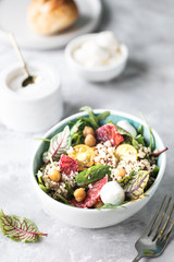 healthy salad with quinoa, vegetables and grapefruit. Vertical