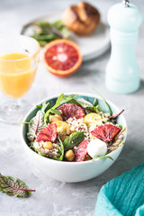 healthy salad with quinoa, vegetables and grapefruit. Vertical