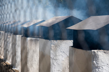 moking chimneys of grills and in an open space in the field for personal use of visitors who can make their personalized lunch