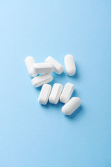 BCAA amino acids. Nutrition for bodybuilding. Fitness supplements on bright paper background. Copy space. 