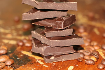 pieces of chocolate on wooden background