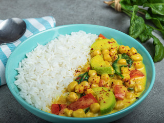 rice, chickpeas, zucchini, with coconut milk and curry  sauce. vegetarian dish