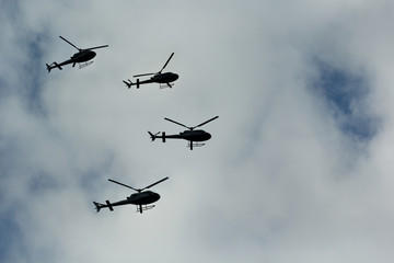 Fototapeta na wymiar Swarm of flying helicopters In The Air 