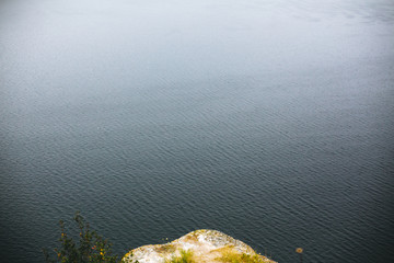 Beautiful view on lake waves. River and cliff with wildflower  landscape. Bakota lake and Dnister river in Ukraine. Travelling and exploring national park. Camping on summer vacation
