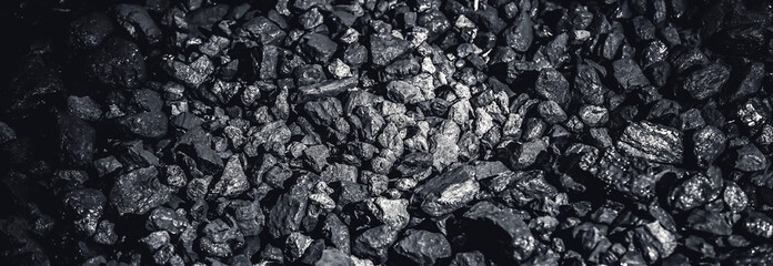Coal miner in the man hands of coal background. Coal mining