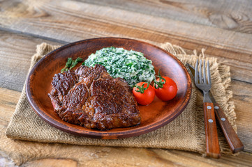 Beef steak with creamy spinach