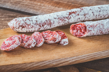 Fuet on the wooden board