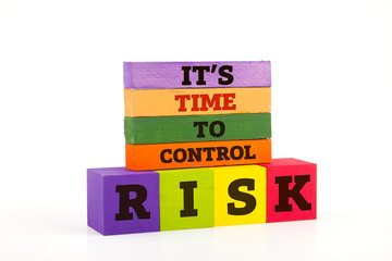 Risk concept using wooden blocks isolated on white.