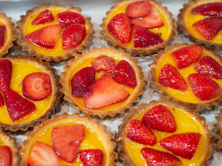 Small strawberry tartlets in a pastry shop
