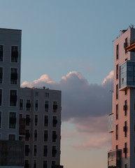 building and  a dramatic sky with clouds