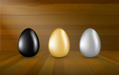 Gold, Black and Silver Eggs Collection on Wooden Background
