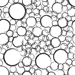 Abstract grunge circle stains seamless pattern. Black circles of different sizes on white background. Wrapping texture with randomly placed round prints. Vector eps8 illustration.