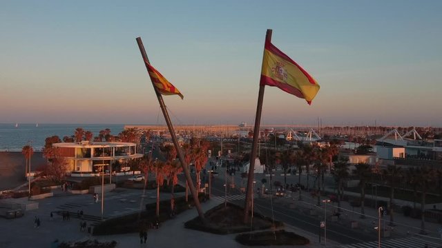 Aerial ZOOM of the Spain flag next to Valencia at sunset with the beach at background, Spain 1080p