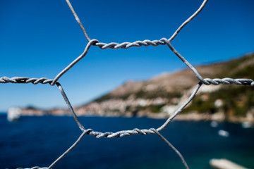Wire fence in front of Mediterranean Sea