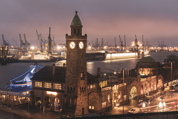 Landungsbrücken at sunset with industrial harbor