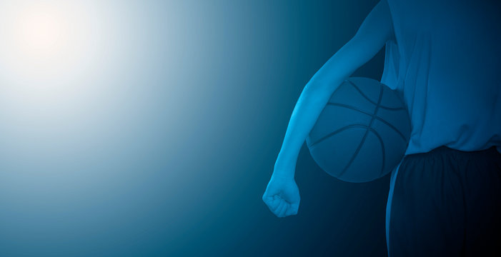 Rear view of a basketball player holding a ball. Close-up.. Blue filter - Powered by Adobe