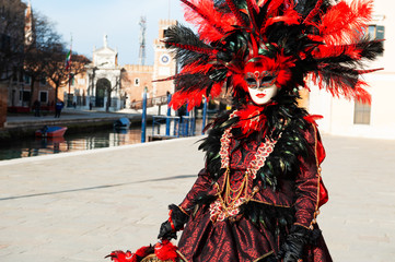 Fototapeta na wymiar Beautiful colorful masks at traditional Venice Carnival in February 2020 in Venice, Italy