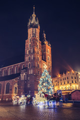 Krakow, Poland, Christmas tree on Main Square and St Mary's church