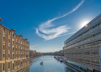 Paris, France - 03 30 2019: View of Bassin de la Villette from the lifting bridge of Flanders at sunset