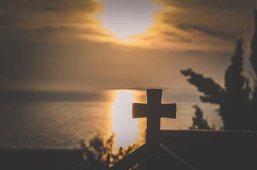 cross on the roof at sunset time