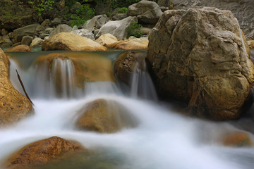 nice small waterfall on mountain river