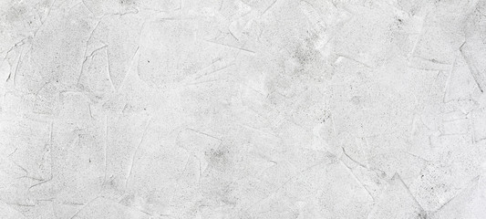 Abstract concrete background, panorama, banner - in the form of a rough covered with folds wall, closeup