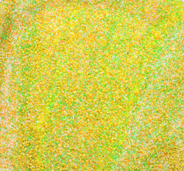 Yellow-green decorative sand textured background. Multi-colored small pebbles, photo background.