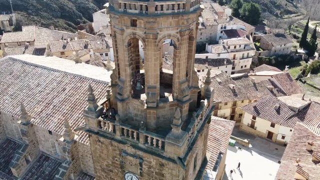 Spectacular family scene on top of a cathedral greeting everyone to the drone that records them. (Rubielos de Mora - Spain)
